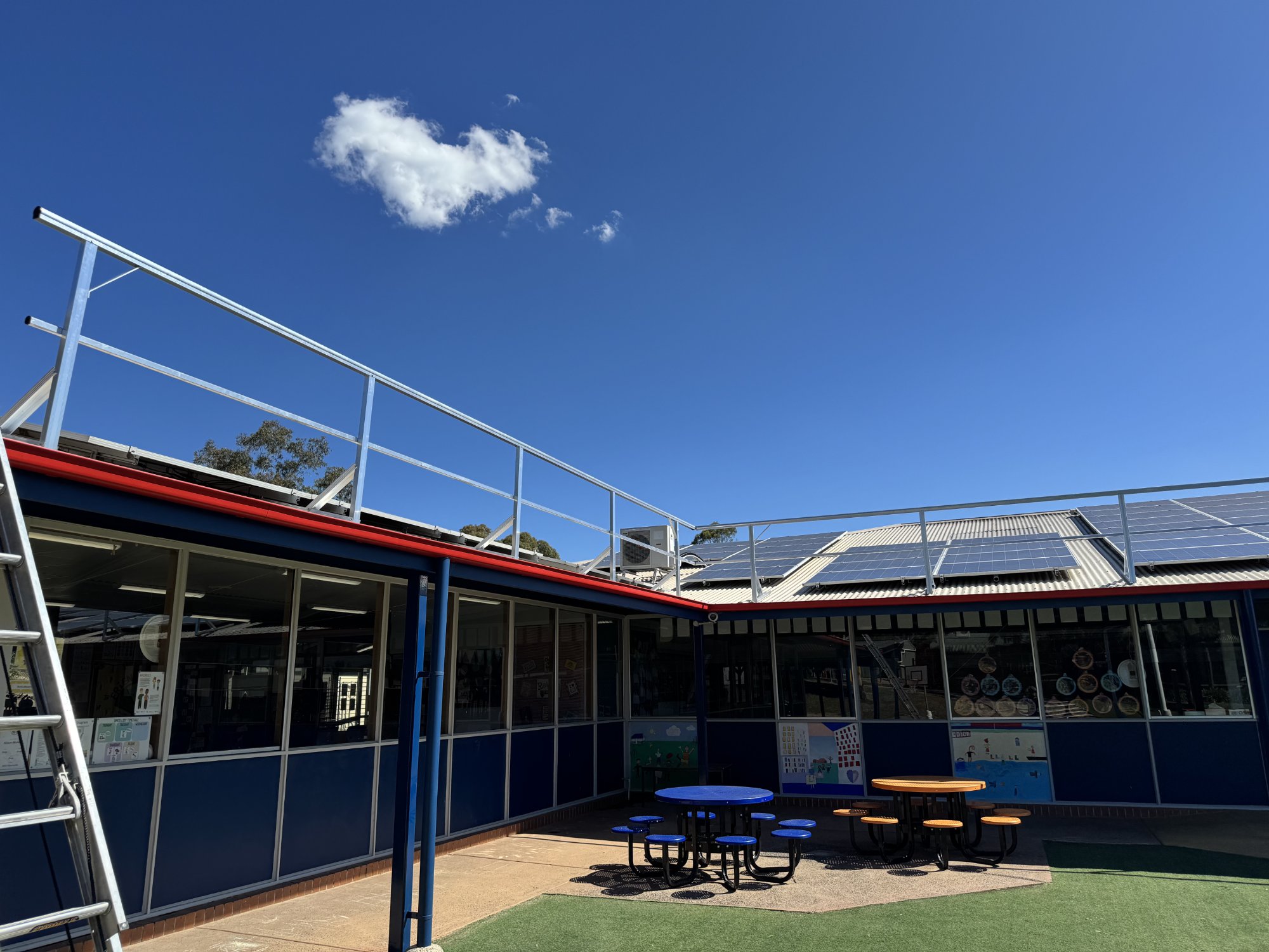 New guardrail system installed on school rooftop