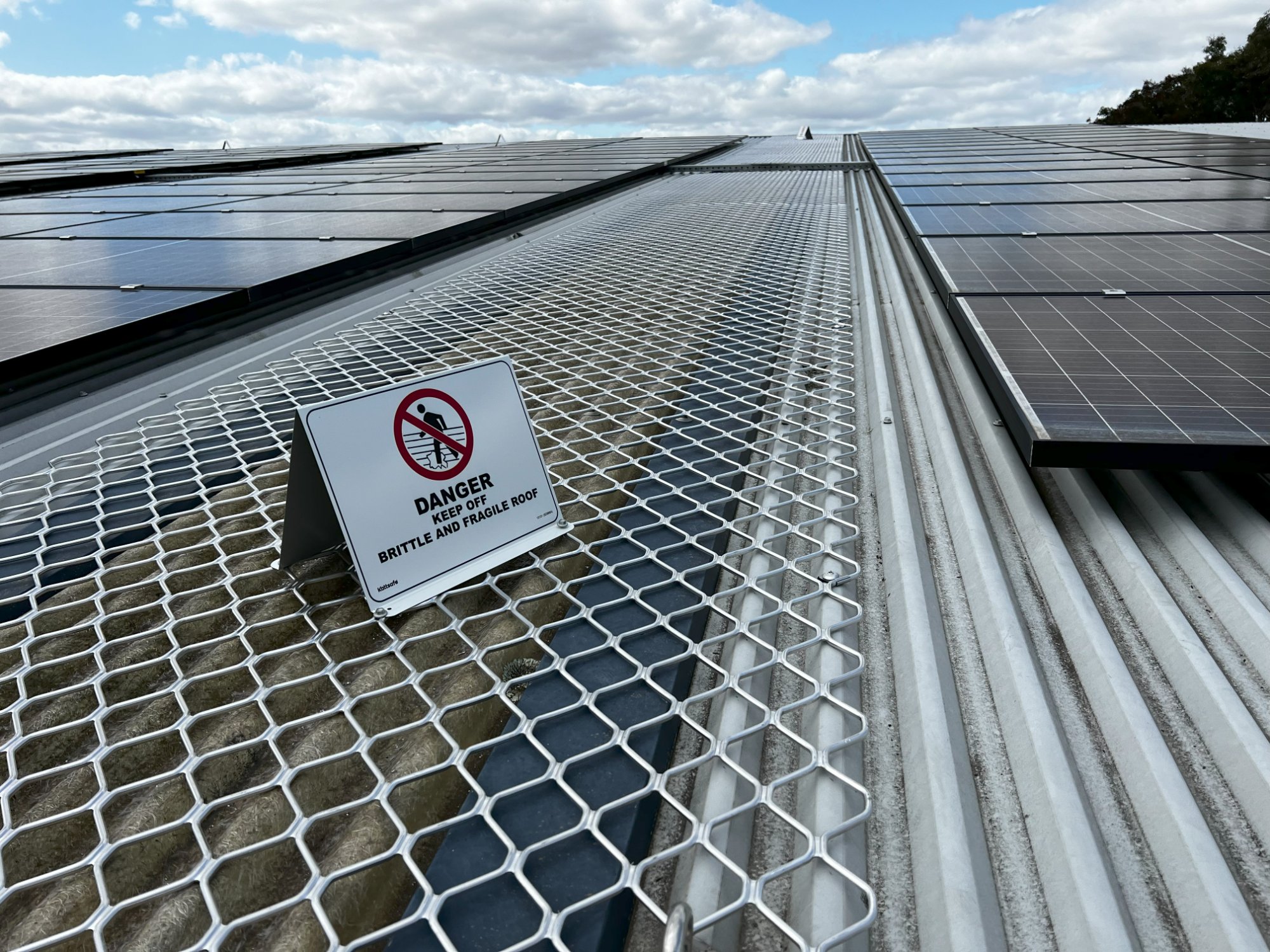 School rooftop compliance audit showing fragile roof safety signage