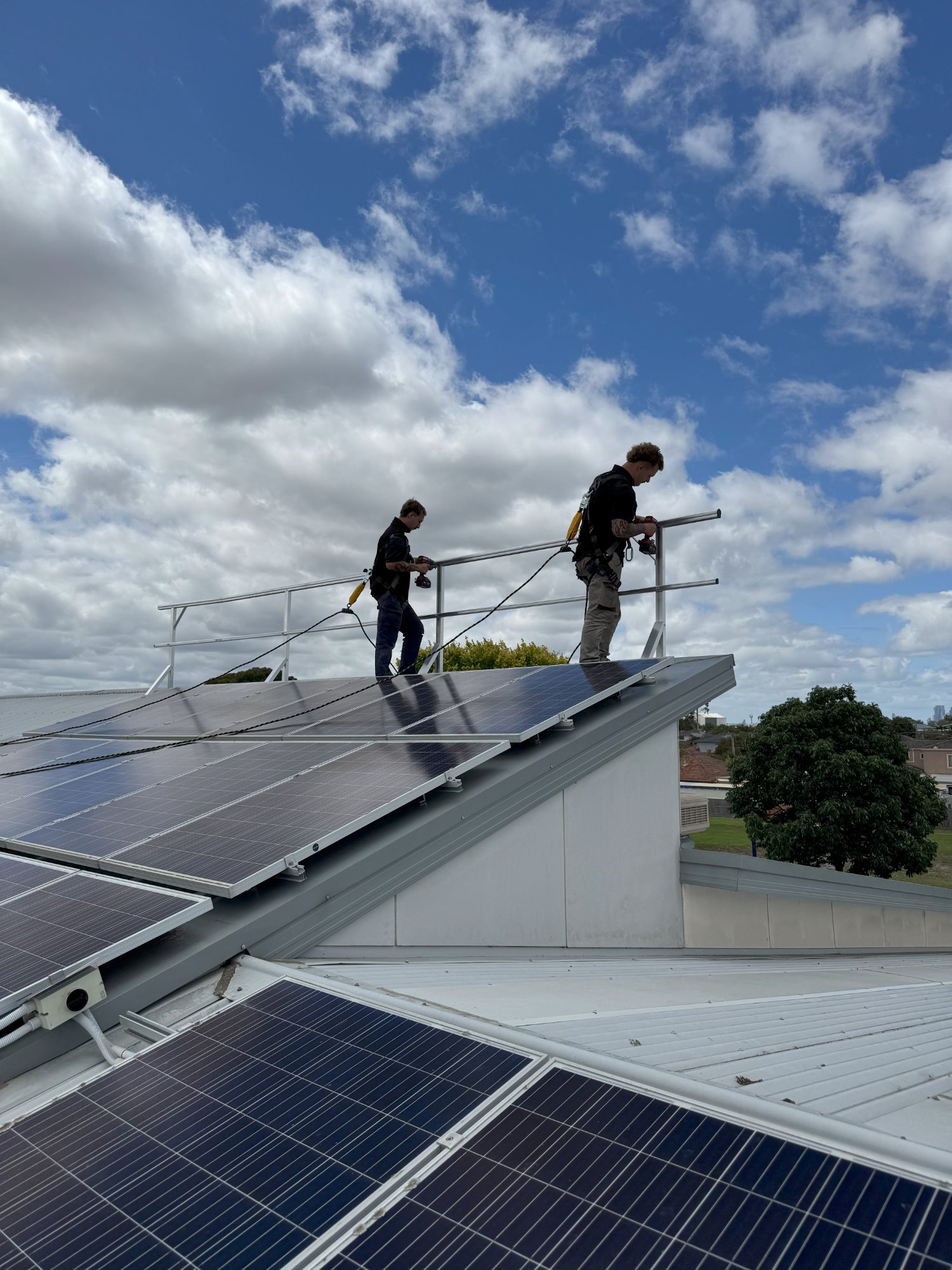 OBHSS technicians conducting annual recertification on school rooftop